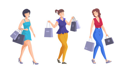 Three happy beautiful women walking with shopping bags