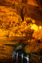Orange lighting of the Huanglong cave, Zhangjiajie, Hunan, China. Vertical image with copy space...