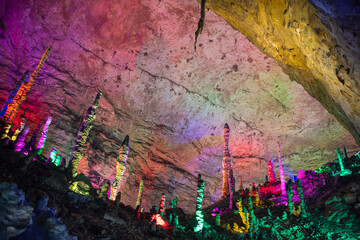 Colorful ceiling in the Huanglong cave, stalactites and stalagmites in Zhangjiajie, Hunan, China. Horizontal image with copy space for text