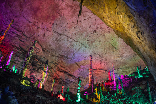 Colorful ceiling in the Huanglong cave, stalactites and stalagmites in Zhangjiajie, Hunan, China, horizontal panoramic shot with copy space for text