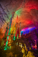 Vertical close up shot of the stunning columns of stalactites and stalagmites of Huanglong cave,...