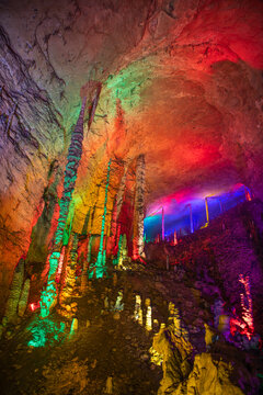 Vertical close up shot of the stunning columns of stalactites and stalagmites of Huanglong cave, Zhangjiajie, Hunan, China, copy space for text