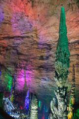 Huge stalagmite growing in Huanglong cave, Zhangjiajie, China. Background image with copy space for text