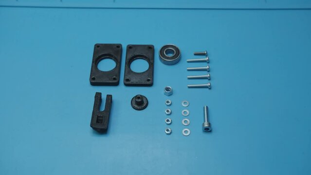 Picking Parts Prepared For Assembly on Blue Table