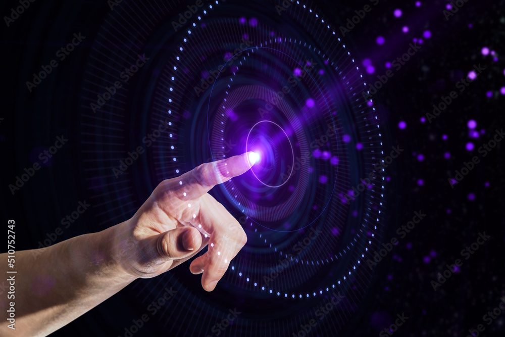 Aufkleber Future technology concept with man finger touching virtual digital interface with purple illuminated button on abstract dark background