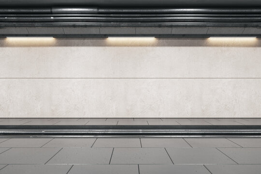 Front view on light grey wall for advertising banner behind rails in abstract empty underground area with lights on top. 3D rendering, mockup