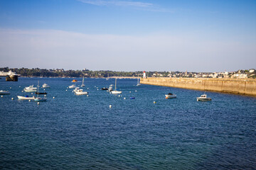 Fototapeta na wymiar Saint-Malo lighthouse and pier view from the city fortifications, Brittany, France
