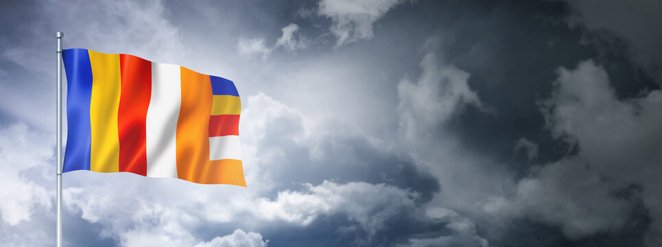 Buddhism flag on a cloudy sky
