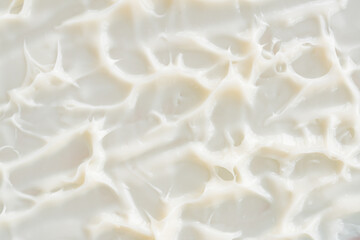 Cream texture. White beauty cream lotion swatch, sunscreen cosmetic smear background. Creamy skincare mousse product close up.
