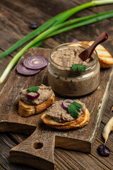 Toasts bread with beans paste, Mexican cuisine pate of beans in glass jar. healthy vegetarian food, vertical image. top view. place for text