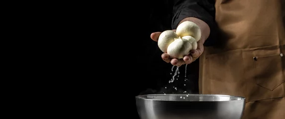 Foto op Plexiglas Cheesemaker, showing freshly made mozzarella. The homemade cheese maker produces caciocavallo. Pasta filata, Traditional Italian mozzarella © Надія Коваль