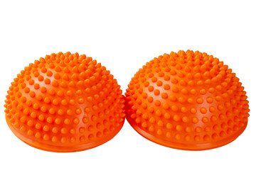 a pair of orange massage hemispheres with spikes, for training coordination and balance, on a white background