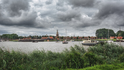 View from the shore to the small Dutch town of Enkhuizen, the Netherlands. - 510759548