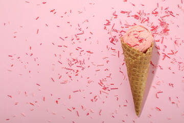 Ice cream on pink background with sprinkles