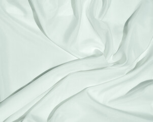 White cloth curve. texture of silk, satin. Shiny fabric background and copy space.