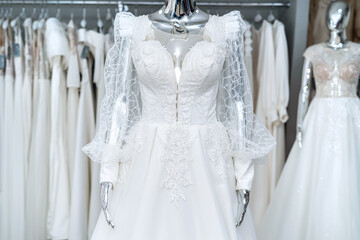Fototapeta na wymiar boutique wedding dress on mannequin in bridal store
