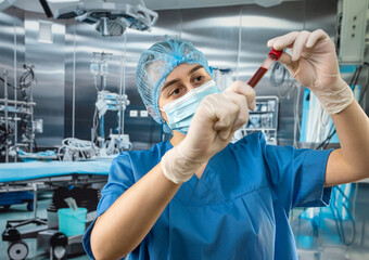 young  nurse hold ready blood probes before surgery in the hospital