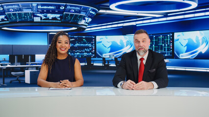 TV Live News Program: Two Diverse Professional Presenters Reporting On the Events. Television Cable...