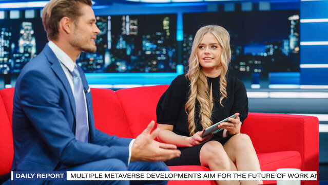 Talk Show TV Program, News Interview and Discussion: Presenter and Guest Talk. Cable Channel Hosts Have Friendly Conversation. Mock-up Television Studio and Newsroom Entertainment Concept