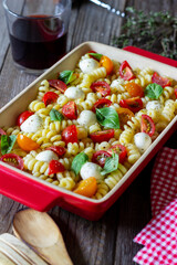 Fusilli pasta with mozzarella, tomatoes and basil. Italian food. Healthy eating. Vegetarian food.