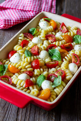 Fusilli pasta with mozzarella, tomatoes and basil. Italian food. Healthy eating. Vegetarian food.