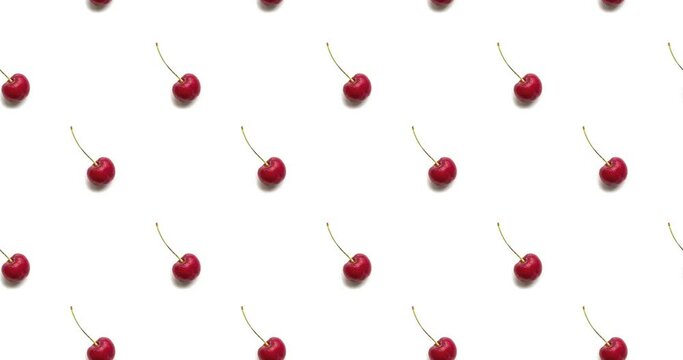 Moving seamless pattern with sweet cherries on a plain white background. Looped 4K footage