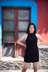 Sensual young latin woman posing in mexican town