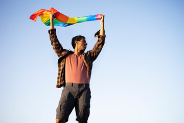 Fototapeta na wymiar Happy man with a pride flag. LGBT community..