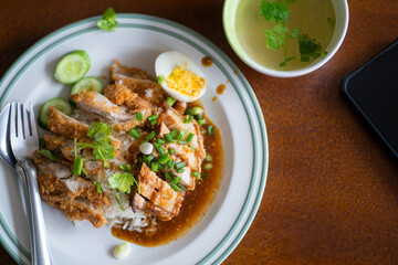 Crispy pork belly on topped with crispy pork and sauce - Asian food style