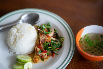 Stir-fried crispy pork belly and basil with rice -  Asian  food style