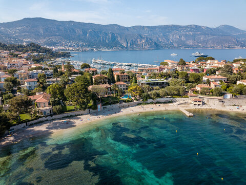 Bay in Saint jean Cap Ferrat near the City of Nice with mountains in the background taken by drone.
