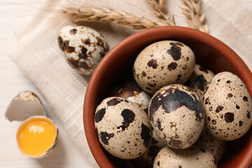 Fresh raw quail eggs on table, top view