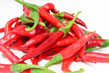 Bunch of fresh red chilli peppers isolated on white background