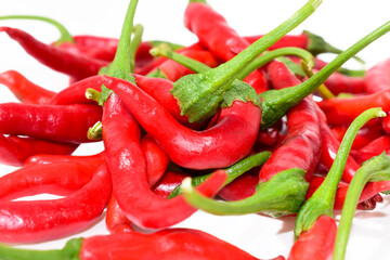 Bunch of fresh red chilli peppers isolated on white background