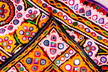 handwork embroidery,Handmade embroidery art. Traditional Indian handmade embroidery art,selective focus,mirror work colorful handmade ahir bharat,Kutch-gujarat