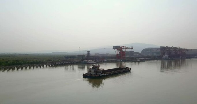 Barge Navigating Across The Amba River Approaching Dolvi Port In Maharashtra, India. wide