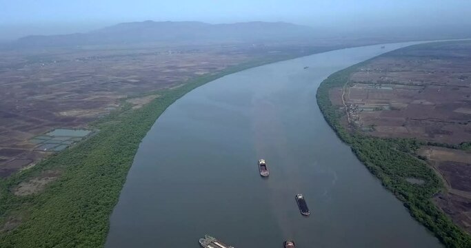 Dry Bulk Cargo Barges Floating In The Amba River In Dolvi, Maharashtra, India. - aerial