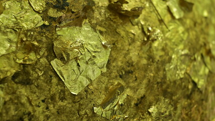 Golden skin attached to the golden Buddha amulet