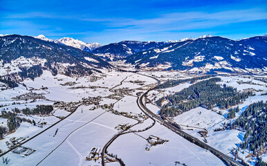 ski lifts on mountains with ski slopes shot in austria
