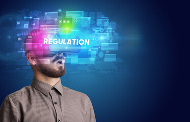 Businessman looking through Virtual Reality glasses