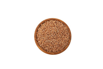 Uncooked whole spelt grain in wooden bowl on white background,top view. Design element, copy space