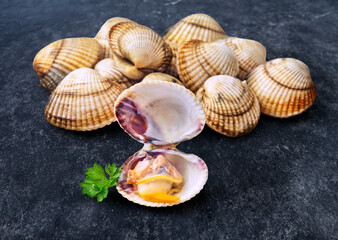 open en closed clams with shellfish isolated on black background