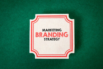 MARKETING BRANDING STRATEGY. Sheet of paper with text on a green background