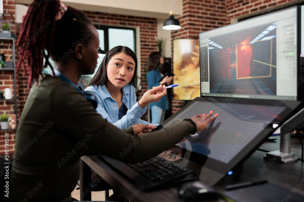 Poster videogame developing company employees working on alpha build of 3d game project while sitting at de