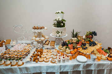 Сake with flowers.Wedding buffet. Sweets on the table
