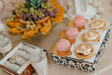 Cake decorated with flowers.Sweet desserts on the table. Sweets in the form of a heart