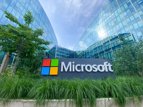 Microsoft sign at the entrance of the headquarters building in Issy les Moulineaux near Paris, France