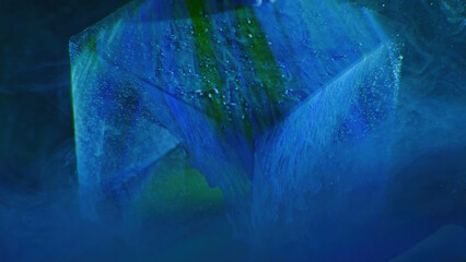 Color glass cube. Underwater abstract background. Ink water drip. Blue green bubble paint on transparent ice crystal angle in mist cloud texture.