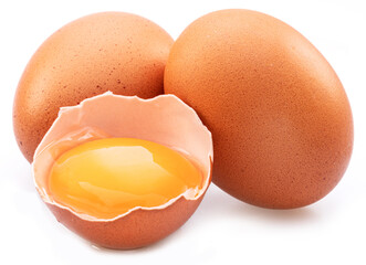 Brown chicken eggs and egg yolk isolated on white background. - obrazy, fototapety, plakaty