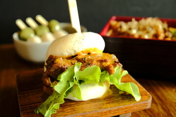Hirata buns.  Japanese steamed buns filled with pork chashu, tempura, karaage. Japanese traditional...
